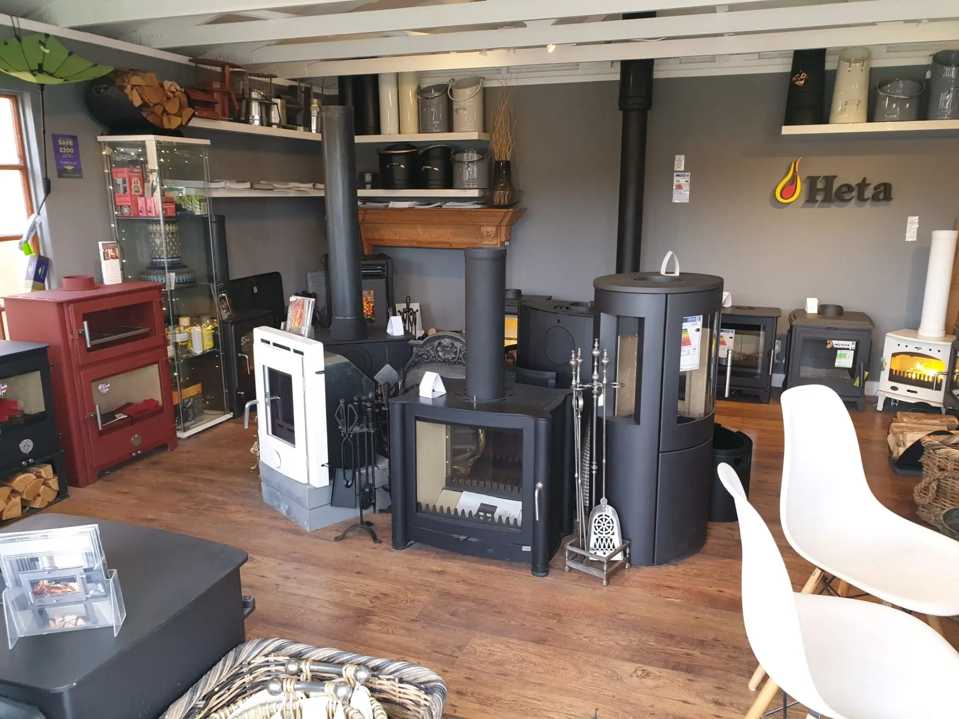 Showroom floor with Heta, Invicta and multi-fuel stove displays on working plinths