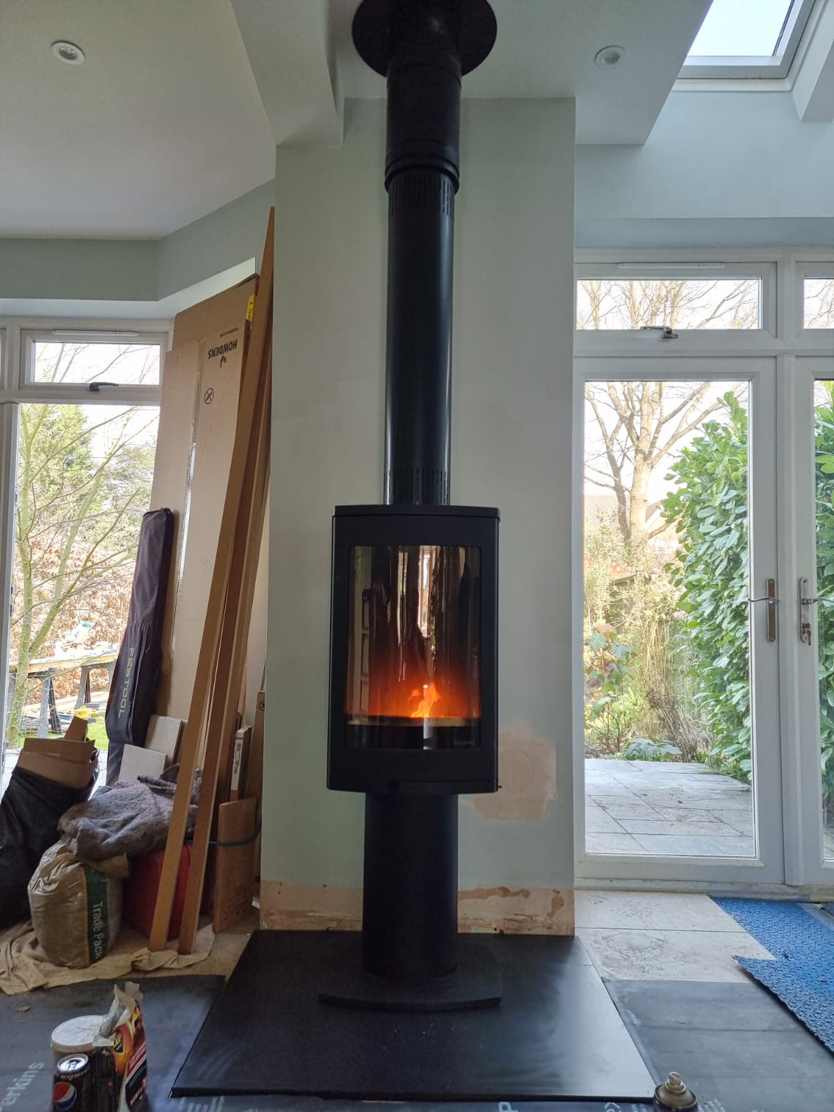Freestanding pedestal stove in a contemporary Berkshire living room